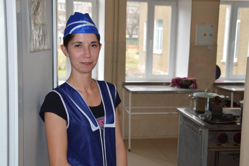 Повар на кухне в Центре